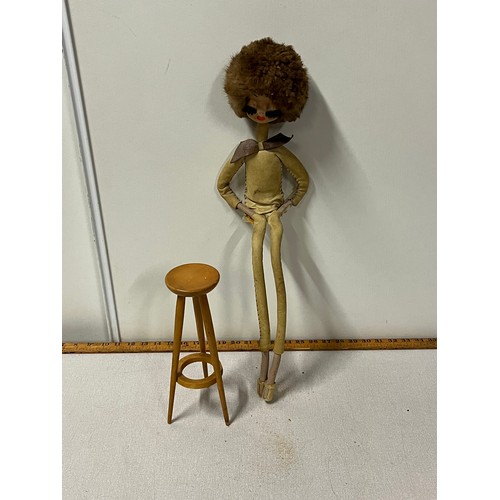 110 - 1970's Retro doll on stool.