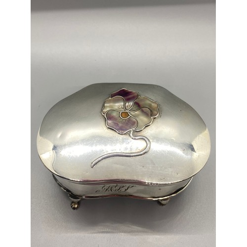 31 - Solid silver MB Hallmarked trinket box on four legs with mother of pearl flower design. 168g.