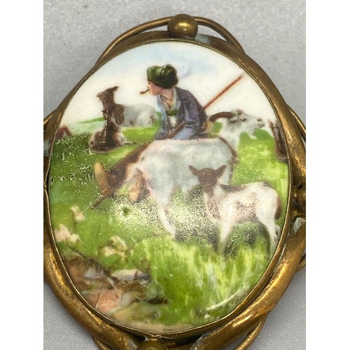 187 - Large victorian painted ceramic brooch with shepherd scene 
Unmarked