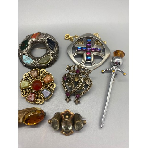 191 - Collection of vintage Scottish brooches.