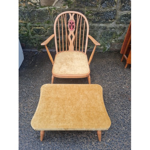 42 - Ercol Windsor upholstered Fleur de lys chair with rare matching footstool.