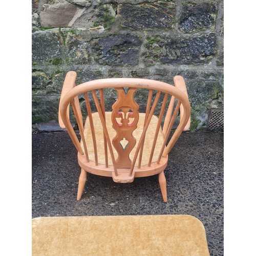 42 - Ercol Windsor upholstered Fleur de lys chair with rare matching footstool.