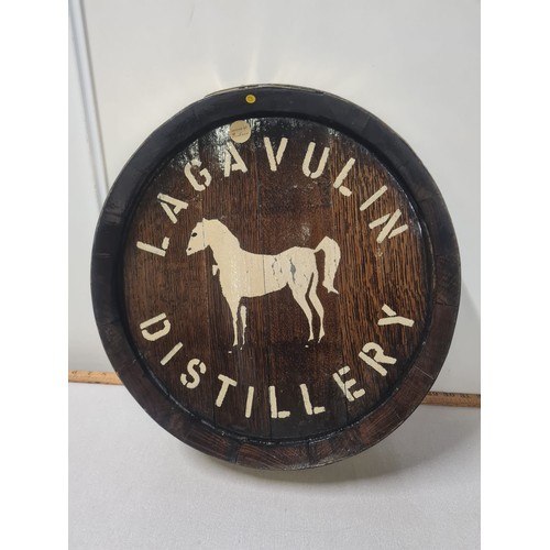 87 - brass bound wooden barrel lid with lagavulin distillery
42cm diameter