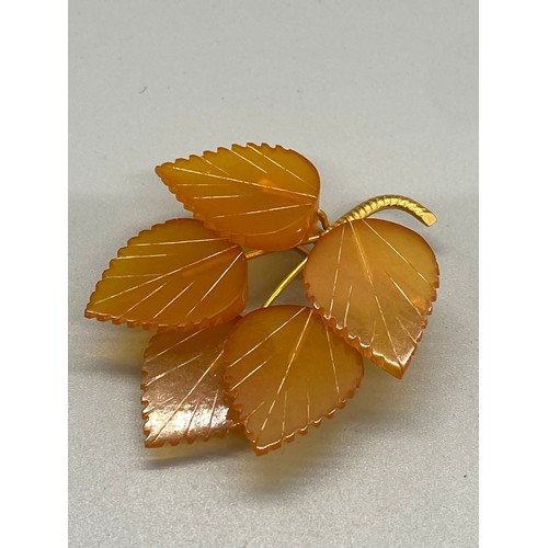 160A - Russian gold plated amber brooch.