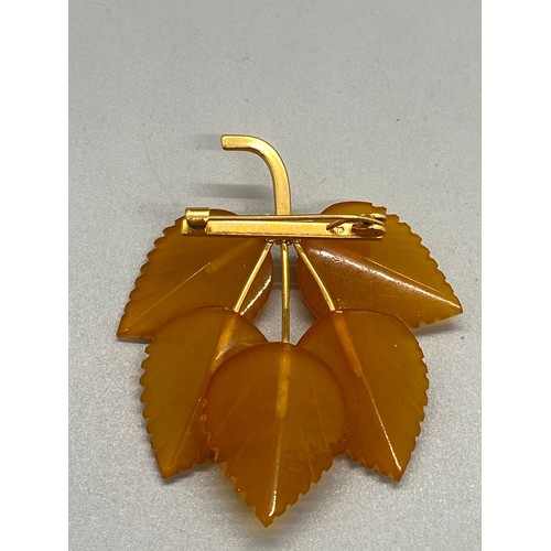 160A - Russian gold plated amber brooch.