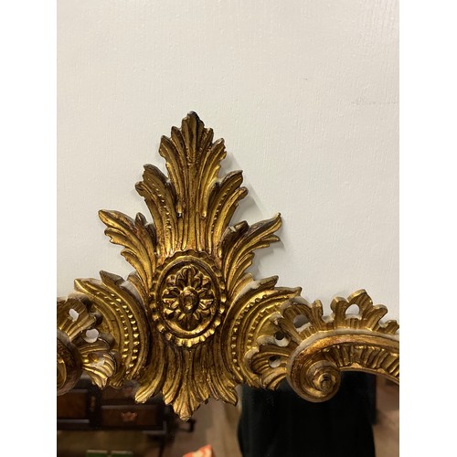 125A - Victorian ornate gilt framed carved wooden mirror. 
100cm x 48cm