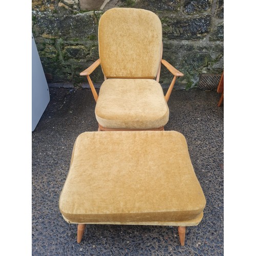 42 - Ercol Windsor upholstered Fleur de lys chair with rare matching footstool.