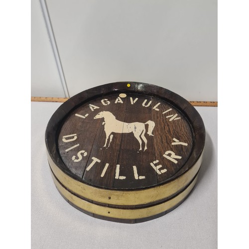 87 - brass bound wooden barrel lid with lagavulin distillery
42cm diameter