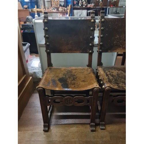 102 - Seven 19th century Jacobean style Walnut and leather chairs; Leather and stud trim finish. Carved cr... 