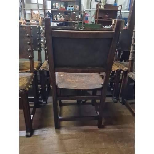 102 - Seven 19th century Jacobean style Walnut and leather chairs; Leather and stud trim finish. Carved cr... 