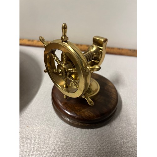 114 - 2 wood & brass ships wheel nutcrackers
Largest 26cm diameter.