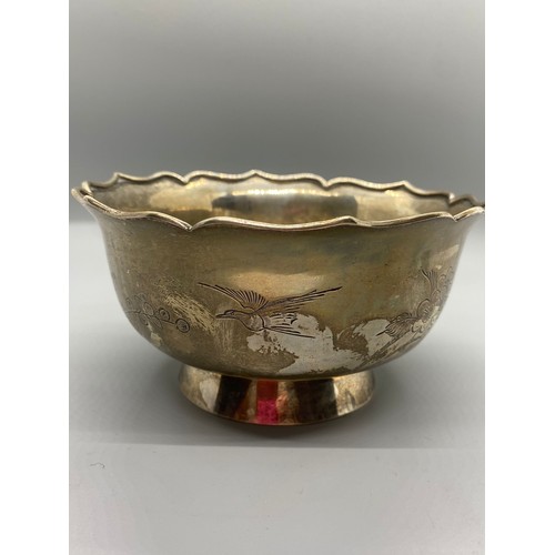 46 - Chinese export silver bowl with bird and flower design. 270g. Signed to base.