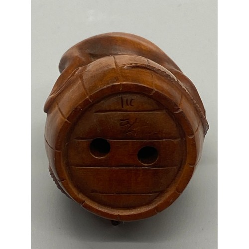 56 - Japanese root wood Netsuke of toad and mouse. Signed to base.