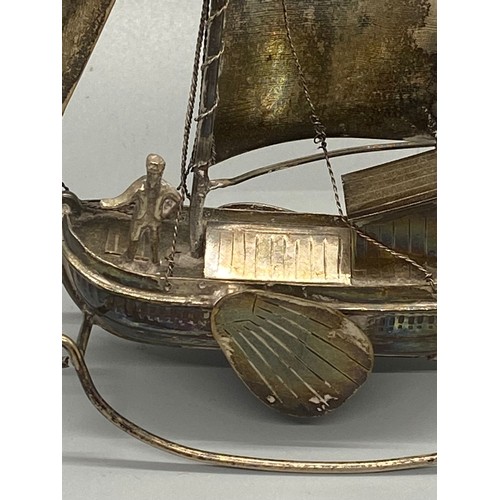 155 - Dutch silver model boat and sailor.