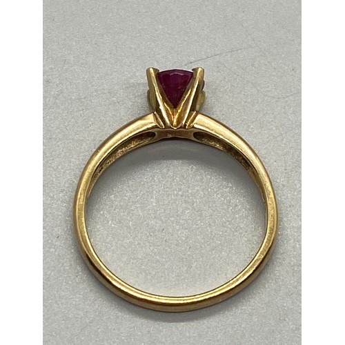 157 - 9ct gold ring set with single ruby.