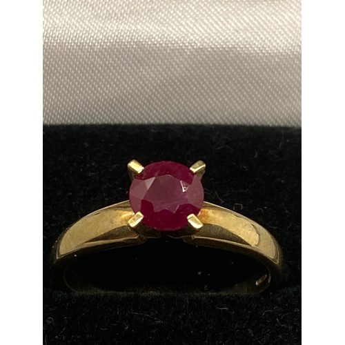 157 - 9ct gold ring set with single ruby.