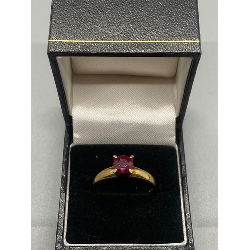 157 - 9ct gold ring set with single ruby.