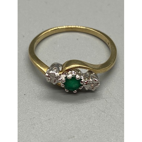 160 - 9ct gold ring set with emerald and diamonds.