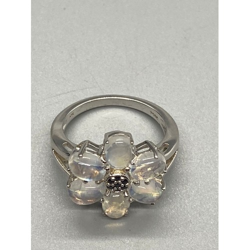 163 - 925 silver and moon stone flower ring.