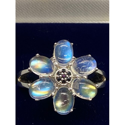 163 - 925 silver and moon stone flower ring.