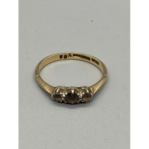 135 - 9ct gold and platinum gem set ring.