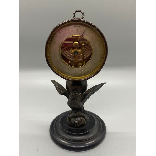 187 - 19th century Halosteric barometer-mounted on a bronze eagle holding another bird in its talons finis... 