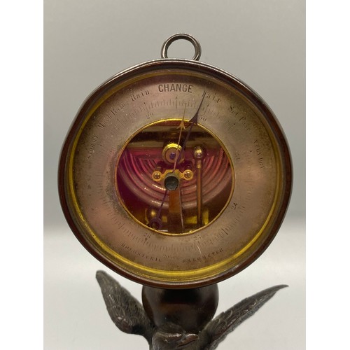 187 - 19th century Halosteric barometer-mounted on a bronze eagle holding another bird in its talons finis... 