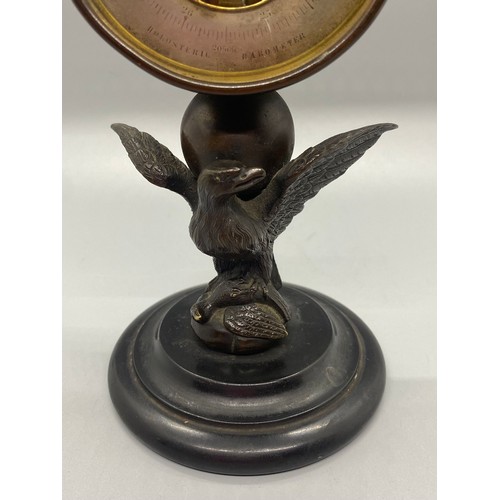 187 - 19th century Halosteric barometer-mounted on a bronze eagle holding another bird in its talons finis... 