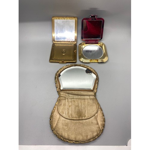 85 - 2 vintage compacts and coin purse.