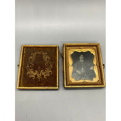 188B - Victorian tin type photo of seated woman in velvet book frame.