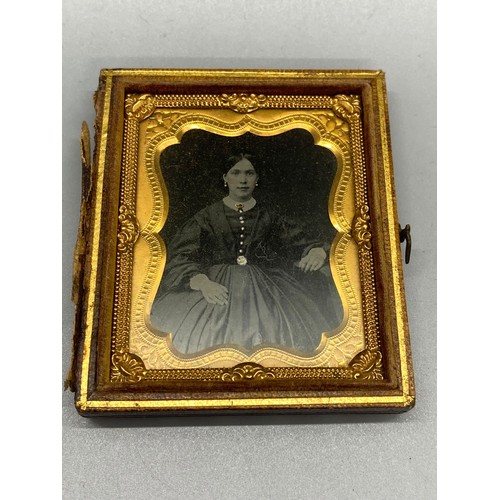 188B - Victorian tin type photo of seated woman in velvet book frame.