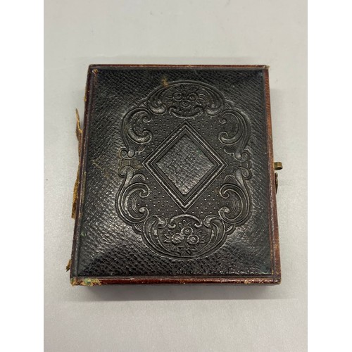 188B - Victorian tin type photo of seated woman in velvet book frame.