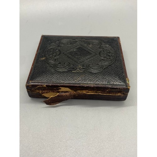 188B - Victorian tin type photo of seated woman in velvet book frame.