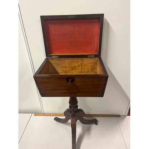 28 - Regency mahogany teapoy, of sarcophagus form, raised on a turned column and tripod base with key.
74... 