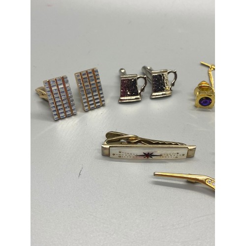 489 - Selection of vintage cufflinks and tie pins.