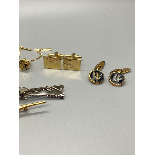 489 - Selection of vintage cufflinks and tie pins.