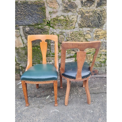 507 - pair of heavy oak green leather arts and crafts chairs.