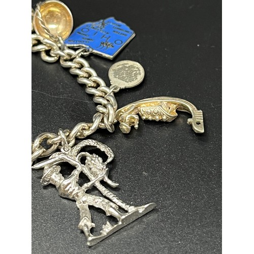 9 - vintage silver charm bracelet with 15 silver charms 
48 grams