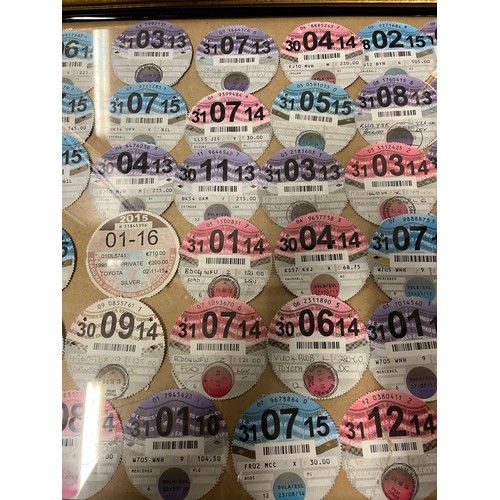 19 - Framed collection of 78 expired tax discs from 2009-2015 to include HGV