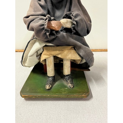 42 - A 19th Century puppet of an elderly lady seated, Dated 1840. 
32cm h