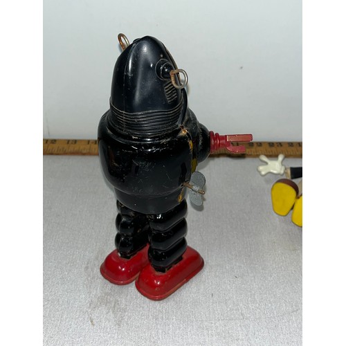 56 - 3 vintage toys to include tinplate wind up  robby the robot by yoshiya of japan , marx toys jimmey c... 