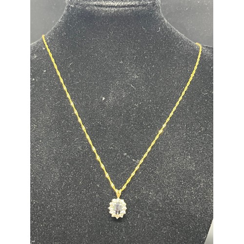 246 - 14ct gold chain along with 9ct gold pendant with blue & white stones.