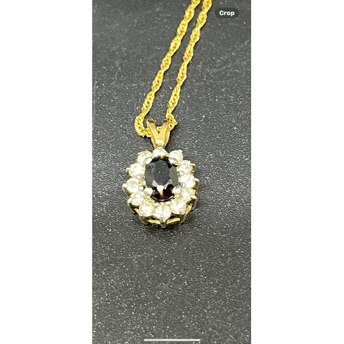 246 - 14ct gold chain along with 9ct gold pendant with blue & white stones.