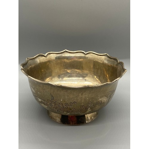 46 - Chinese export silver bowl with bird and flower design. 270g. Signed to base.