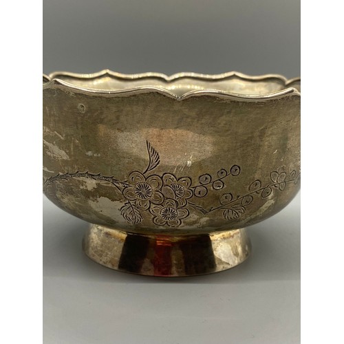 46 - Chinese export silver bowl with bird and flower design. 270g. Signed to base.