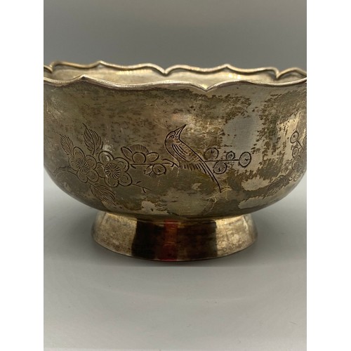 46 - Chinese export silver bowl with bird and flower design. 270g. Signed to base.