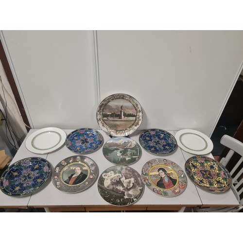 375 - Collection of 11 Royal Doulton decorative plates.