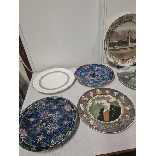 375 - Collection of 11 Royal Doulton decorative plates.