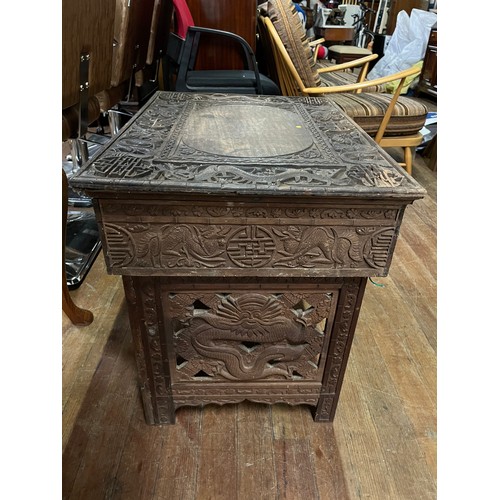 387 - Chinese carved folding tea table (has recently been treated for woodworm)
64cm x 47cm x 54cm open