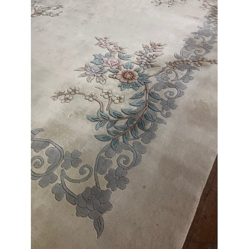 175 - A Large Chinese inspired Neutral wool rug. 
approx [370x273cm] 12ftx9ft